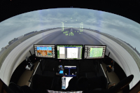 Two seated pilots commanding an aircraft en route